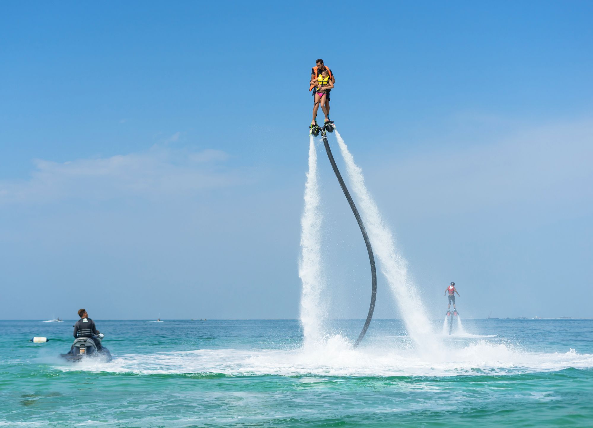 Father and daughter flyboarding