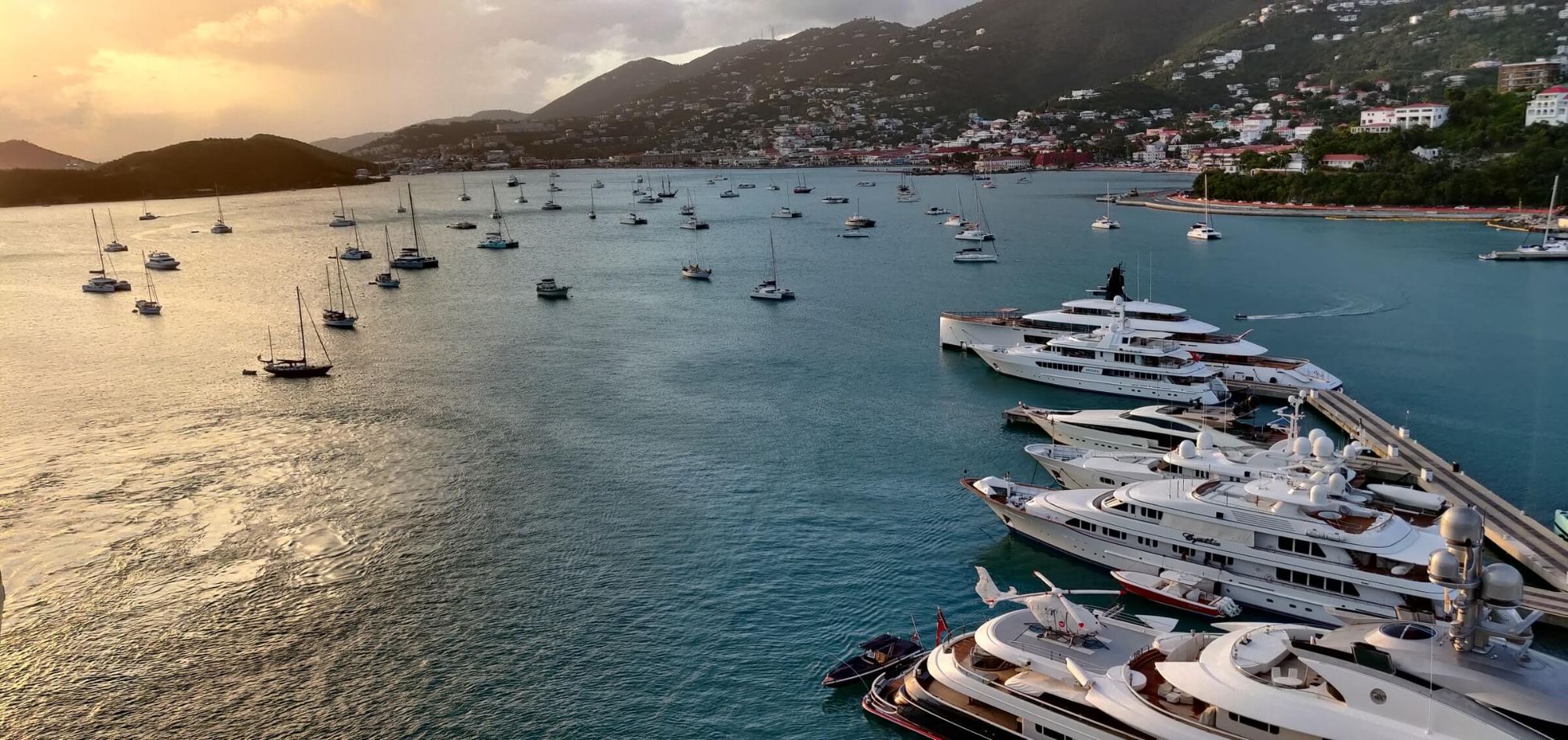 Sunset over a megayacht marina