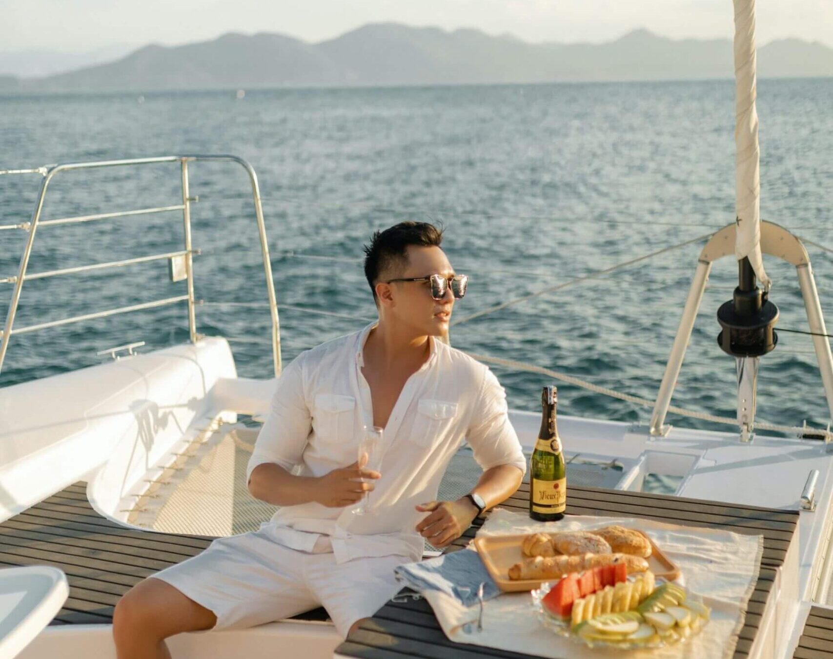 man celebrating on a charter yacht