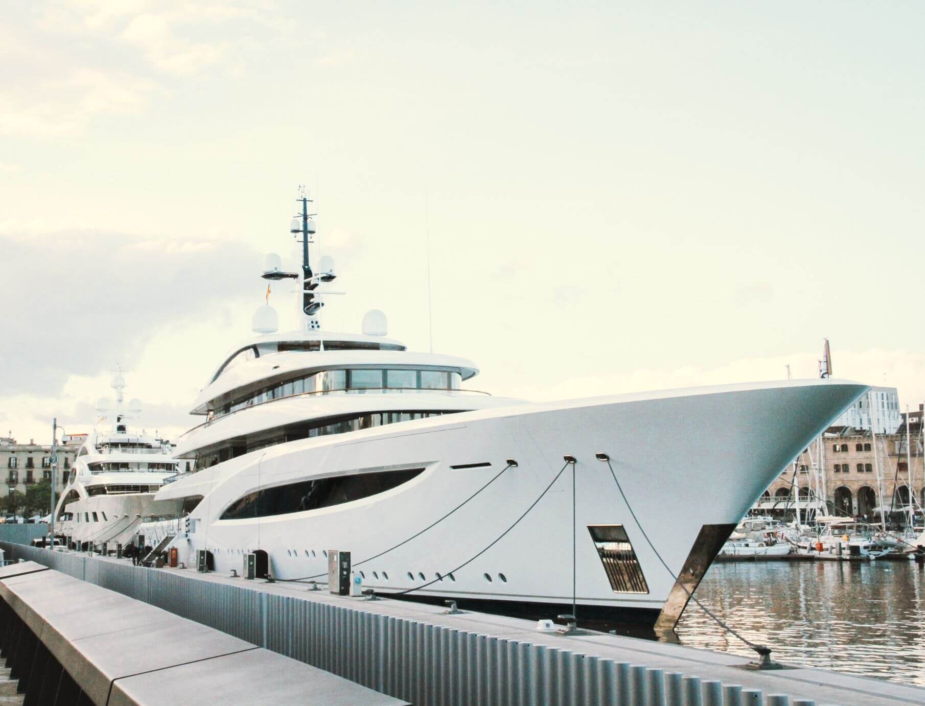 two large superyachts in a port